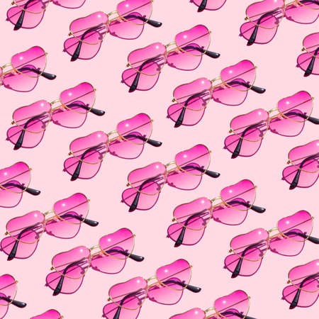 Pink sunglasses pattern on pink backgroundの写真素材