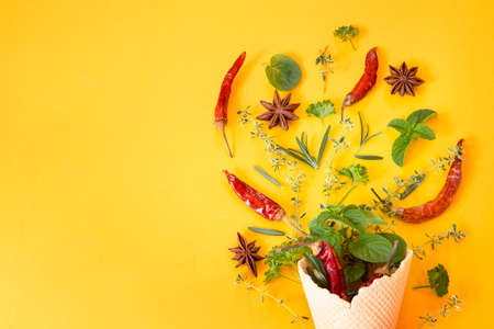 Spices on yellow backgroundの写真素材