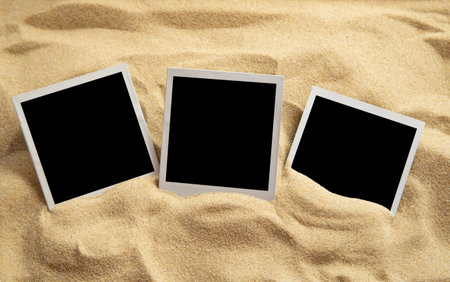 Blank instant images on sand backgroundの写真素材