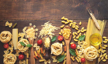 Various pasta on wooden backgroundの写真素材