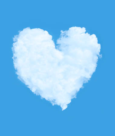Heart shaped cloud against blue skyの写真素材