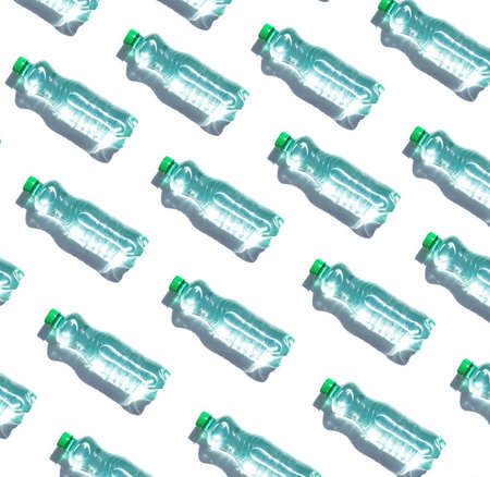 Mineral water bottles pattern on white backgroundの写真素材