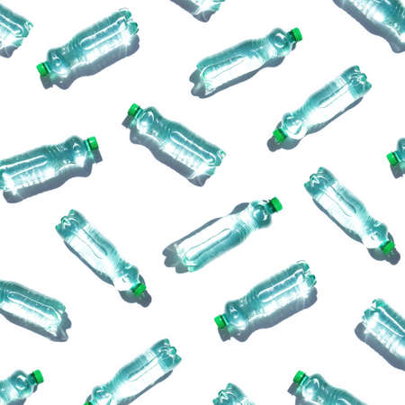 Mineral water bottles pattern on white backgroundの写真素材