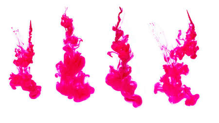 Purple ink in water on white backgroundの写真素材