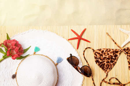 Summer accessories on sand backgroundの写真素材