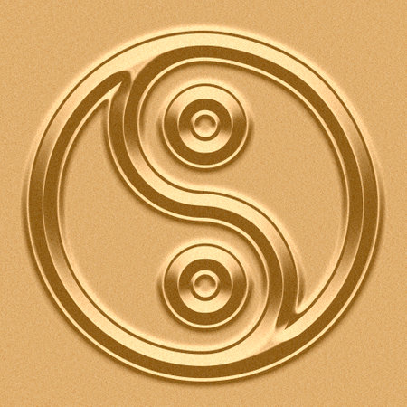 Yin Yang Symbol in sand backgroundの写真素材