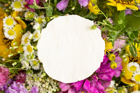 Spring flowers with a craft paper blanck noteの写真素材