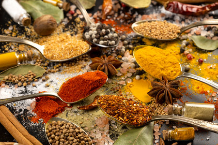 Various spices in vintage spoons