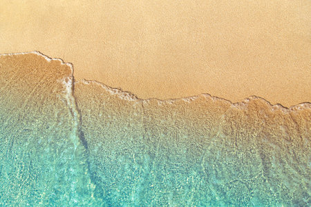 Sea wave on beach sandの写真素材