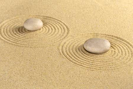 Zen garden with sand pattern and stonesの写真素材