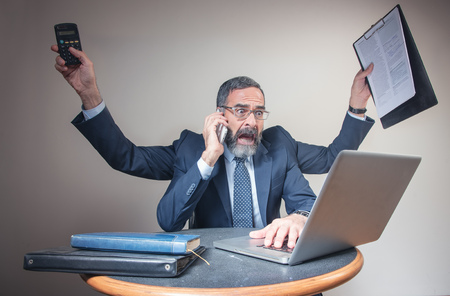 Senior elderly business man with multiple arms multitasking and finishing many jobs at once