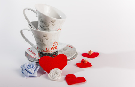 Valentines Day celebration in two: hot beverage cups, white backgroundの写真素材