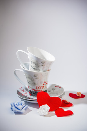 Valentines Day celebration in two: hot beverage cups, white backgroundの写真素材