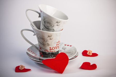 Valentines Day celebration in two: hot beverage cups, white backgroundの写真素材