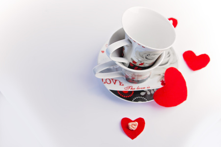 Valentines Day celebration in two: hot beverage cups, white backgroundの写真素材