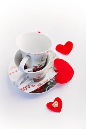 Valentines Day celebration in two: hot beverage cups, white backgroundの写真素材