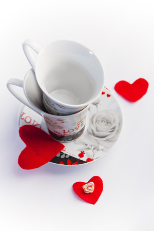 Valentines Day celebration in two: hot beverage cups, white backgroundの写真素材