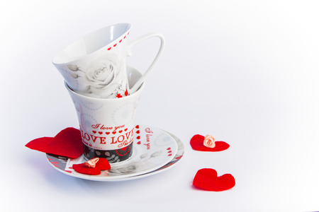 Valentines Day celebration in two: hot beverage cups, white backgroundの写真素材