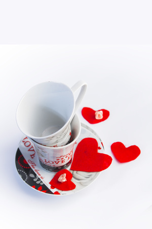 Valentines Day celebration in two: hot beverage cups, white backgroundの写真素材