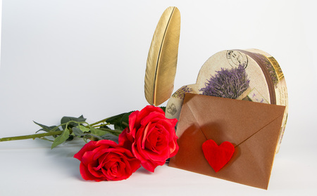 Love letter for valentine, romantic setup with an envelope with sweet words for a loved one, white backgroundの写真素材