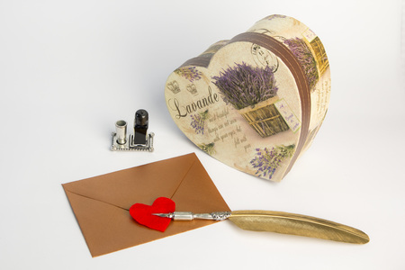 Love letter for valentine, romantic setup with an envelope with sweet words for a loved one, white backgroundの写真素材