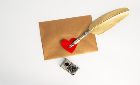 Love letter for valentine, romantic setup with an envelope with sweet words for a loved one, white backgroundの写真素材