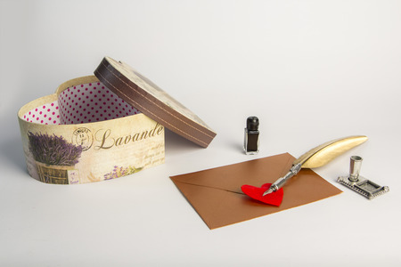 Love letter for valentine, romantic setup with an envelope with sweet words for a loved one, white backgroundの写真素材