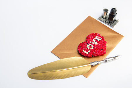 Love letter for valentine, romantic setup with an envelope with sweet words for a loved one, white backgroundの写真素材
