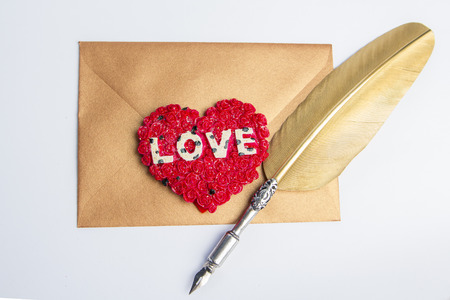 Love letter for valentine, romantic setup with an envelope with sweet words for a loved one, white backgroundの写真素材