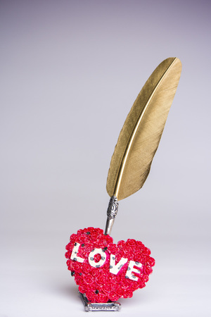 Love letter for valentine, romantic setup with an envelope with sweet words for a loved one, white backgroundの写真素材
