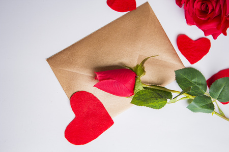 Love letter for valentine, romantic setup with an envelope with sweet words for a loved one, white backgroundの写真素材