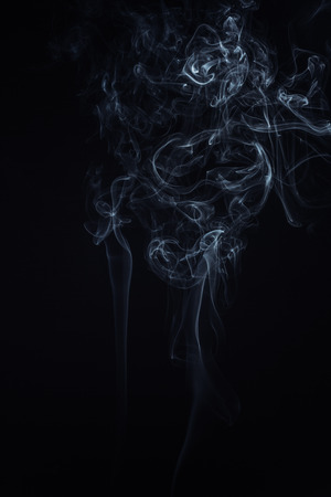 Swirly cloud of smoke on black background, used for design and as various graphic resourceの写真素材