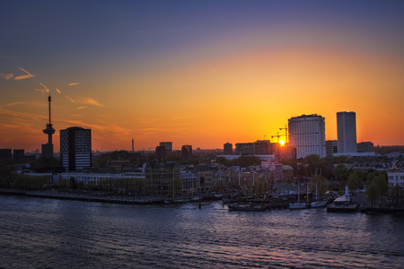 APRIL 2015, ROTTERDAM NETHERLANDS: Modern buildings of Rotterdam in sunset, aligned on the shoreのeditorial素材