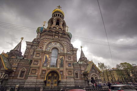 JUNE, 2015: ST. PETERSBURG, RUSSIA - Church of Spilled Blood on a cloudy day, surrounded by visitors and tourists. One of Russias main historic monuments.のeditorial素材