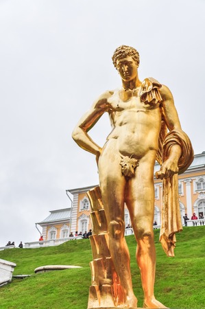 MAY 2015, PETERHOF PALACE - SAINT PETERSBURG, RUSSIA: Peterhof Palace, famous monumental building with water streams and large golden statues around itのeditorial素材