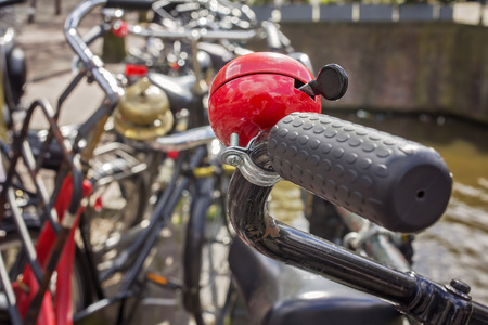Amsterdams most famous mode of transportation, closeup of a bicycle and its alarm ringの写真素材