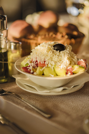 So called shopska salad, traditional addition to a meal in any restaurant, seasonal saladの写真素材