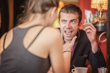 Young couple arguing in a cafe. Relationship problems.の写真素材