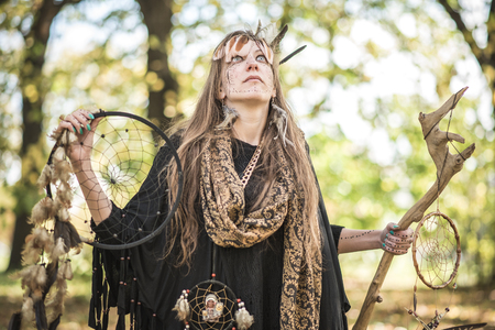 Shaman indian, native american, woman casting spells in natureの写真素材
