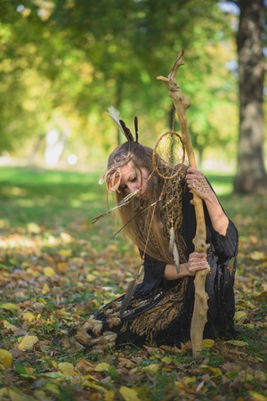 Shaman indian, native american, woman casting spells in natureの写真素材