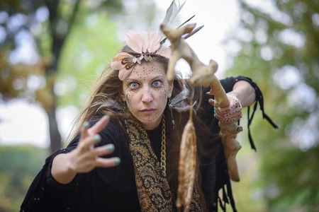 Shaman indian, native american, woman casting spells in natureの写真素材