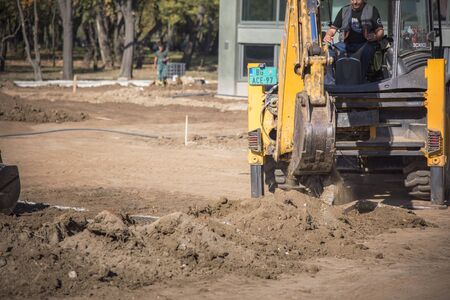 OCTOBER 2017, BELGRADE SERBIA: Renovation of Museum of Contemporary Art in Belgrade, earth diggers, bulldozers and construction workers working tirelessly on a sunny dayのeditorial素材