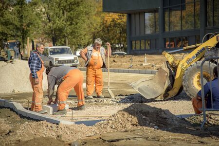 OCTOBER 2017, BELGRADE SERBIA: Renovation of Museum of Modern Art in Belgrade, earth diggers, bulldozers and construction workers working tirelessly on a sunny dayのeditorial素材