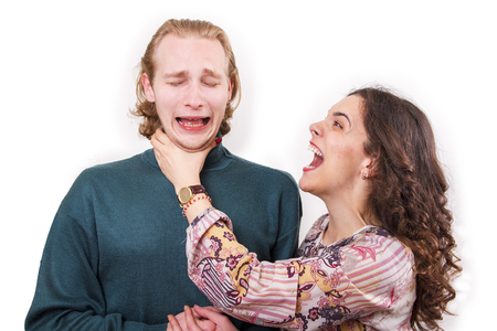 Married couple problems, wife choking her husband, furious with himの写真素材