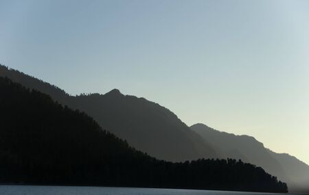 Mountains similar to Brezhnev and dragon on Teletskoye Lakeの写真素材