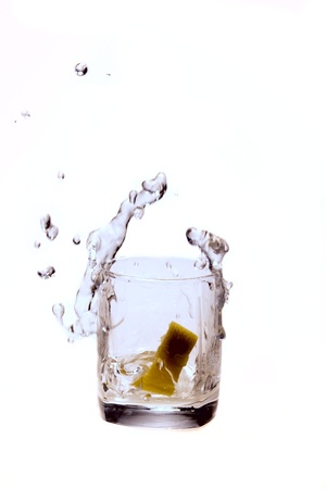 a splash of water and a lemonの写真素材
