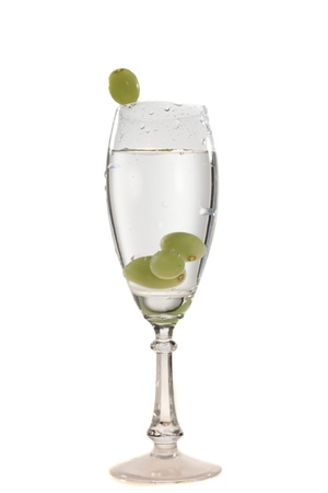 a glass of water and a grapeの写真素材