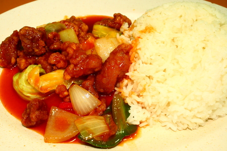 Chinese dish, sweet sour pork and rice Singapore food dinner の写真素材