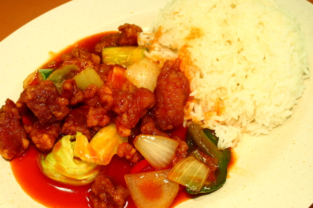 Chinese dish, sweet sour pork and rice Singapore food dinner の写真素材