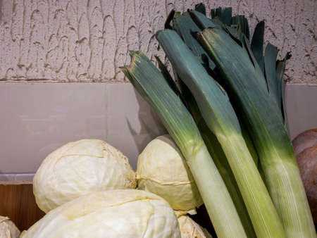 Home harvest - pumpkin, cabbage, leeks. Autumn vegetables in spring from farms and greenhouses. Wood...